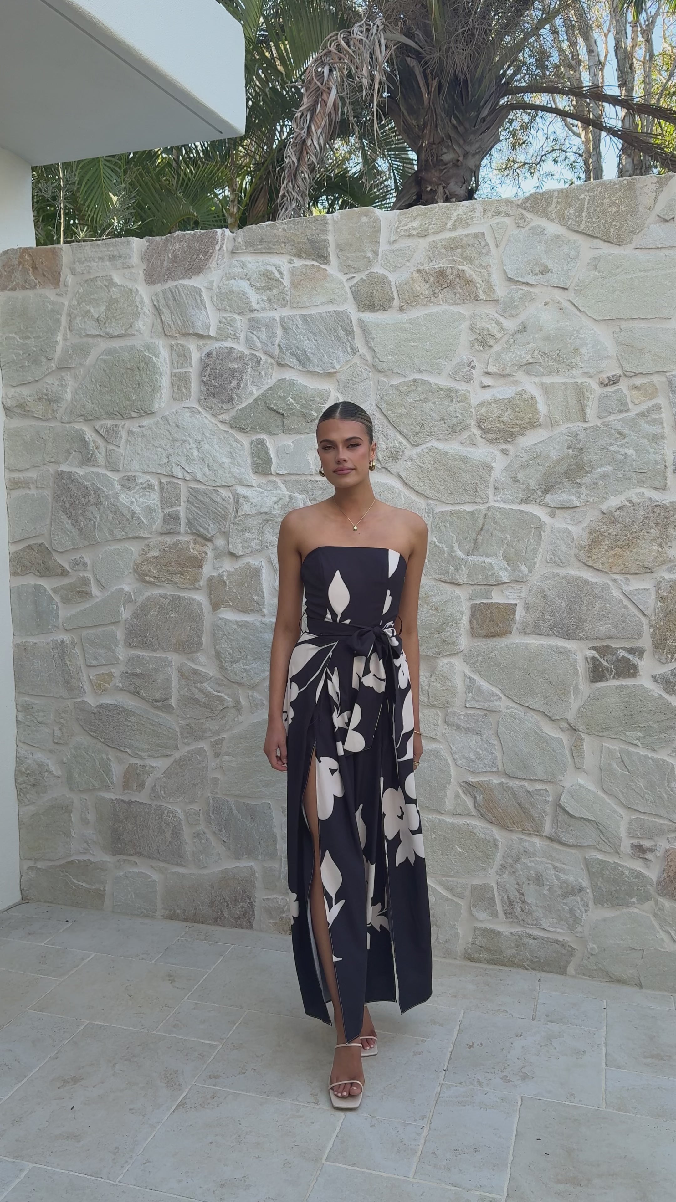 Load video: Carson Front Split Strapless Jumpsuit - Black Floral - Billy J